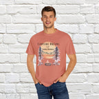 Campfire Dreams and Summer Memories Unisex Garment-Dyed T-shirt. Escape to the great outdoors with our Campfire Dreams and Summer Memories Garment-Dyed T-shirt. Made from soft, high-quality fabric, this shirt is perfect for cozy nights by the fire or creating unforgettable summer memories. Featuring the graphics of a scenery of a sunset, trees, patio lights, a fire pit and two wood chairs.