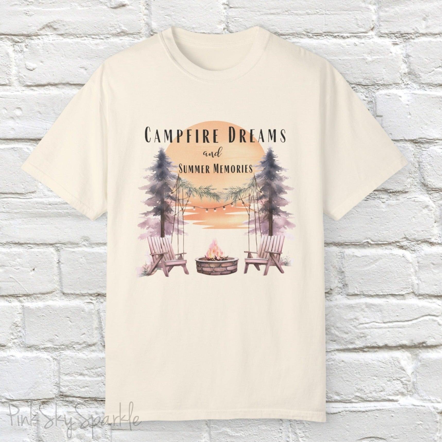 Campfire Dreams and Summer Memories Unisex Garment-Dyed T-shirt. Escape to the great outdoors with our Campfire Dreams and Summer Memories Garment-Dyed T-shirt. Made from soft, high-quality fabric, this shirt is perfect for cozy nights by the fire or creating unforgettable summer memories. Featuring the graphics of a scenery of a sunset, trees, patio lights, a fire pit and two wood chairs.