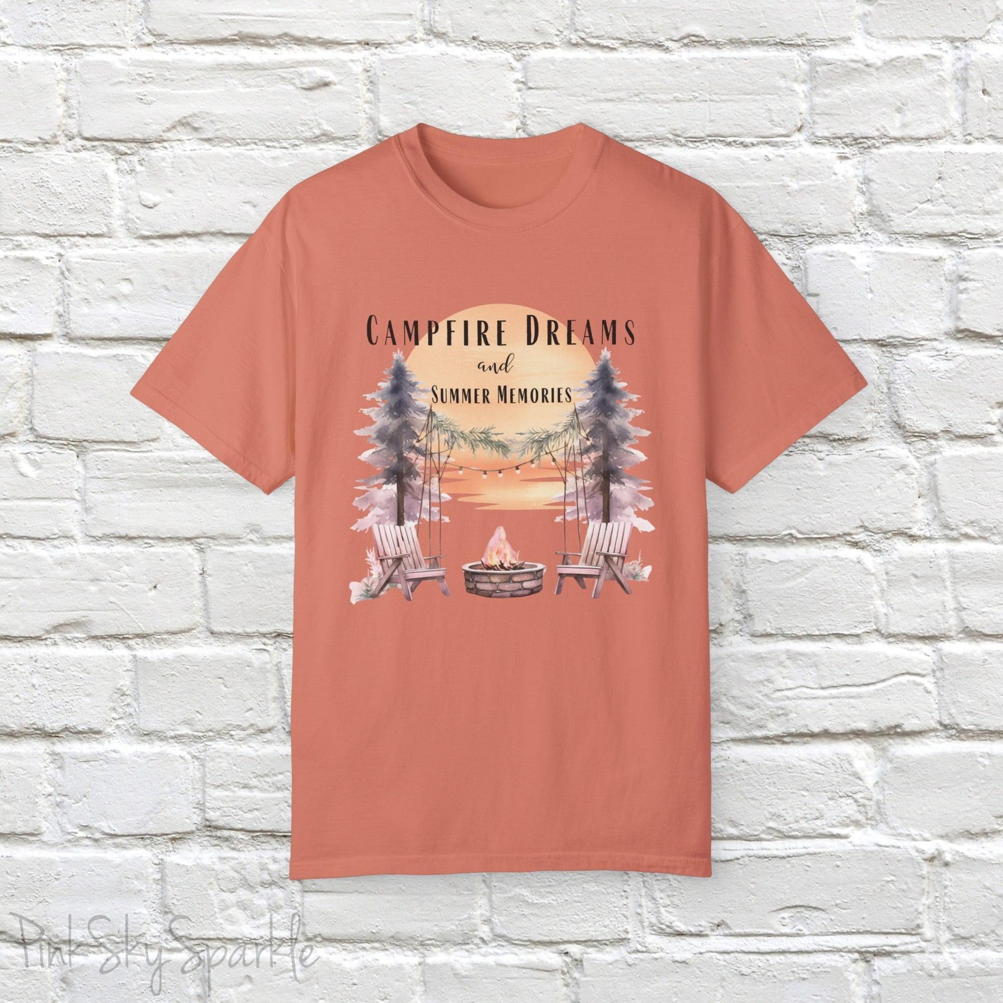 Campfire Dreams and Summer Memories Unisex Garment-Dyed T-shirt. Escape to the great outdoors with our Campfire Dreams and Summer Memories Garment-Dyed T-shirt. Made from soft, high-quality fabric, this shirt is perfect for cozy nights by the fire or creating unforgettable summer memories. Featuring the graphics of a scenery of a sunset, trees, patio lights, a fire pit and two wood chairs.