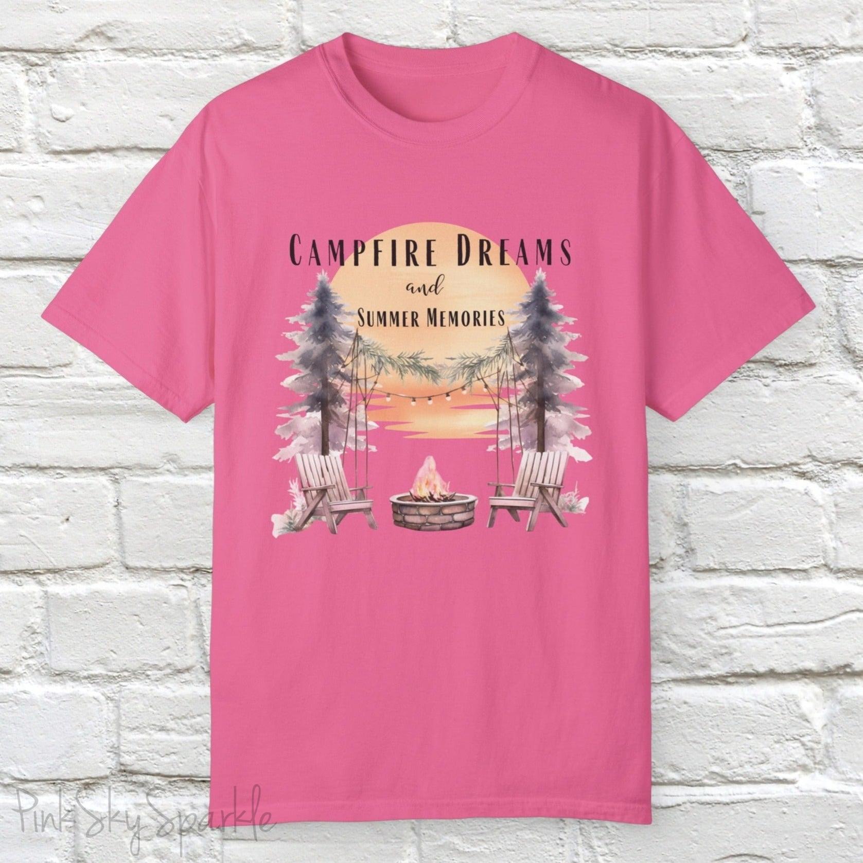 Campfire Dreams and Summer Memories Unisex Garment-Dyed T-shirt. Escape to the great outdoors with our Campfire Dreams and Summer Memories Garment-Dyed T-shirt. Made from soft, high-quality fabric, this shirt is perfect for cozy nights by the fire or creating unforgettable summer memories. Featuring the graphics of a scenery of a sunset, trees, patio lights, a fire pit and two wood chairs.