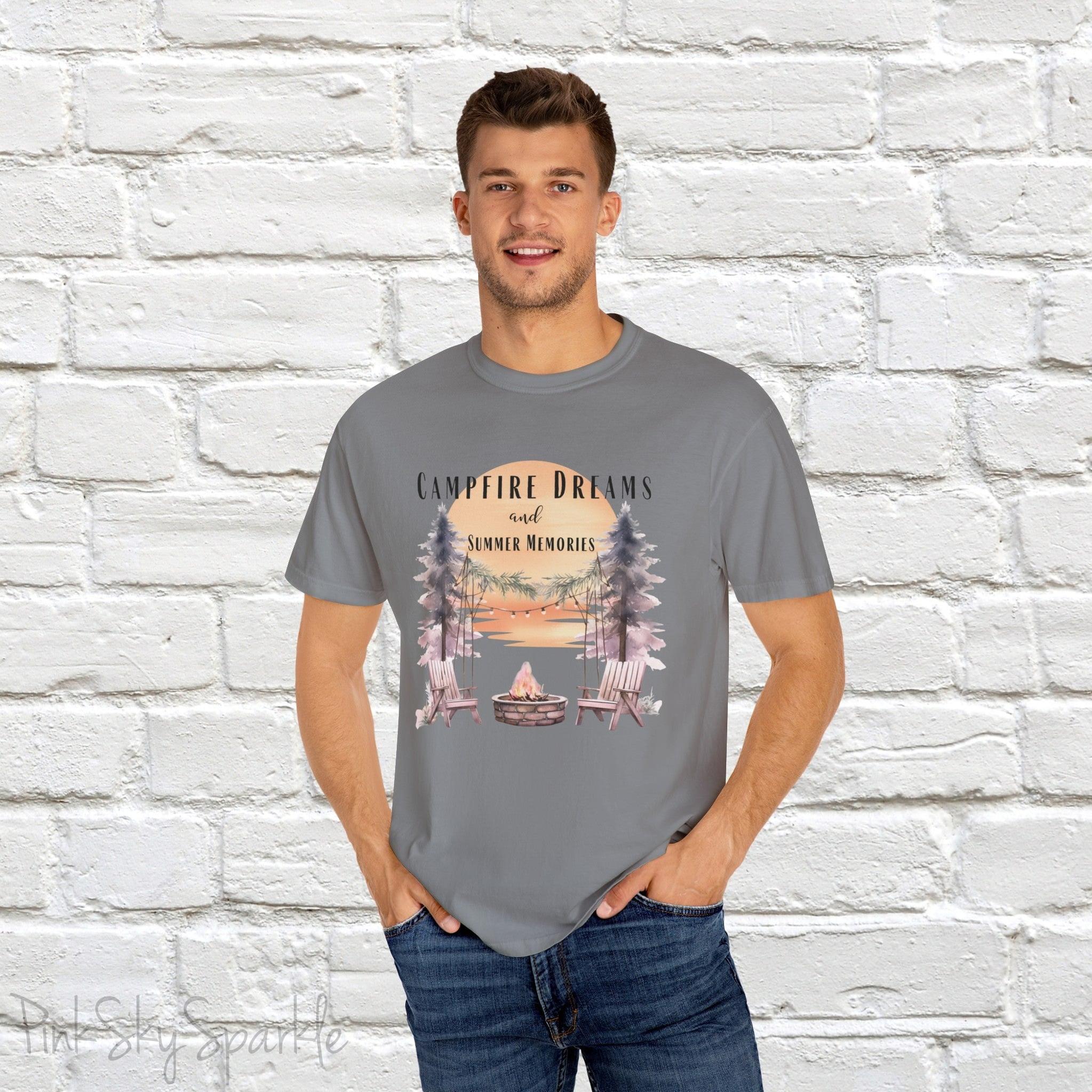 Campfire Dreams and Summer Memories Unisex Garment-Dyed T-shirt. Escape to the great outdoors with our Campfire Dreams and Summer Memories Garment-Dyed T-shirt. Made from soft, high-quality fabric, this shirt is perfect for cozy nights by the fire or creating unforgettable summer memories. Featuring the graphics of a scenery of a sunset, trees, patio lights, a fire pit and two wood chairs.