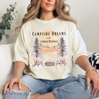 Campfire Dreams and Summer Memories Unisex Garment-Dyed T-shirt. Escape to the great outdoors with our Campfire Dreams and Summer Memories Garment-Dyed T-shirt. Made from soft, high-quality fabric, this shirt is perfect for cozy nights by the fire or creating unforgettable summer memories. Featuring the graphics of a scenery of a sunset, trees, patio lights, a fire pit and two wood chairs.
