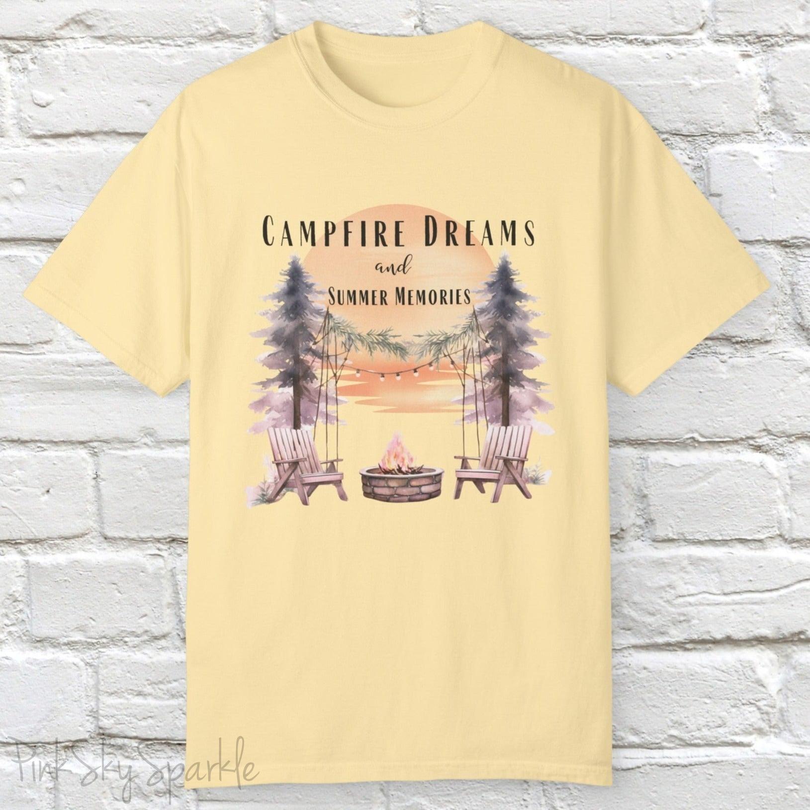 Campfire Dreams and Summer Memories Unisex Garment-Dyed T-shirt. Escape to the great outdoors with our Campfire Dreams and Summer Memories Garment-Dyed T-shirt. Made from soft, high-quality fabric, this shirt is perfect for cozy nights by the fire or creating unforgettable summer memories. Featuring the graphics of a scenery of a sunset, trees, patio lights, a fire pit and two wood chairs.