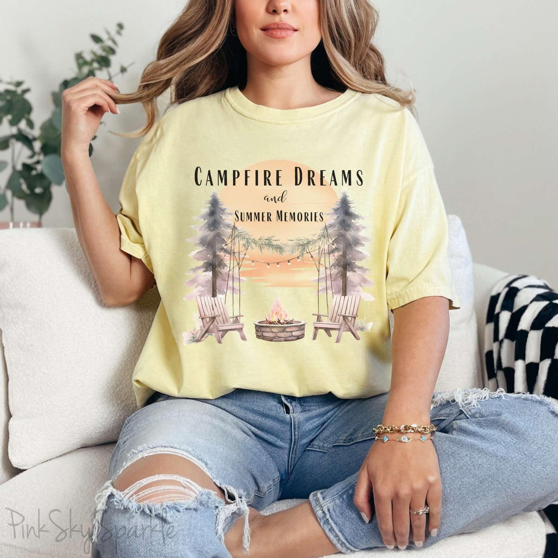 Campfire Dreams and Summer Memories Unisex Garment-Dyed T-shirt. Escape to the great outdoors with our Campfire Dreams and Summer Memories Garment-Dyed T-shirt. Made from soft, high-quality fabric, this shirt is perfect for cozy nights by the fire or creating unforgettable summer memories. Featuring the graphics of a scenery of a sunset, trees, patio lights, a fire pit and two wood chairs.