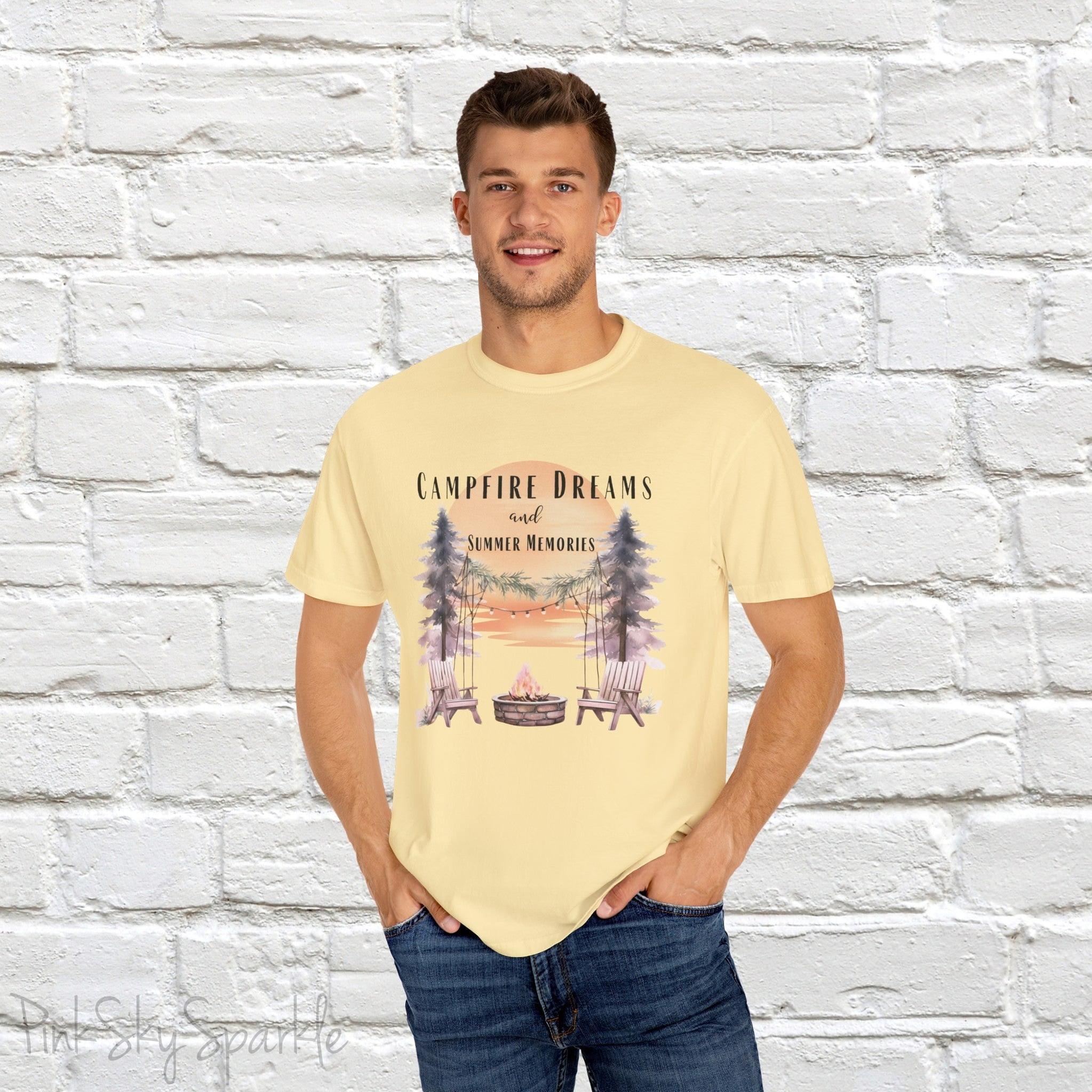Campfire Dreams and Summer Memories Unisex Garment-Dyed T-shirt. Escape to the great outdoors with our Campfire Dreams and Summer Memories Garment-Dyed T-shirt. Made from soft, high-quality fabric, this shirt is perfect for cozy nights by the fire or creating unforgettable summer memories. Featuring the graphics of a scenery of a sunset, trees, patio lights, a fire pit and two wood chairs.