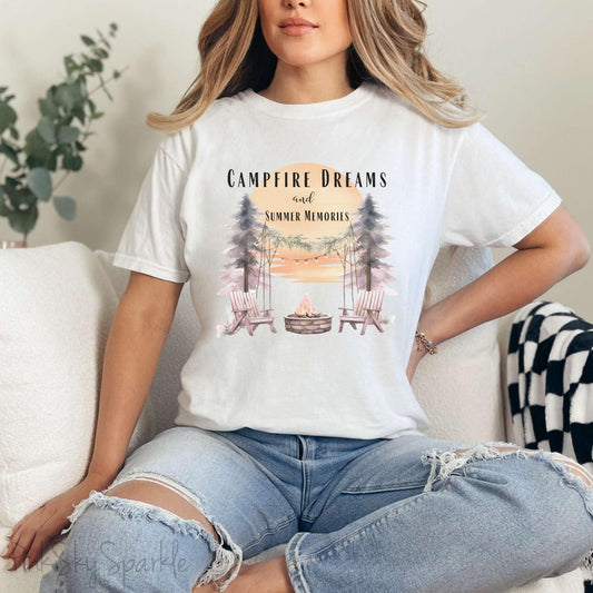 Campfire Dreams and Summer Memories Unisex Garment-Dyed T-shirt. Escape to the great outdoors with our Campfire Dreams and Summer Memories Garment-Dyed T-shirt. Made from soft, high-quality fabric, this shirt is perfect for cozy nights by the fire or creating unforgettable summer memories. Featuring the graphics of a scenery of a sunset, trees, patio lights, a fire pit and two wood chairs.