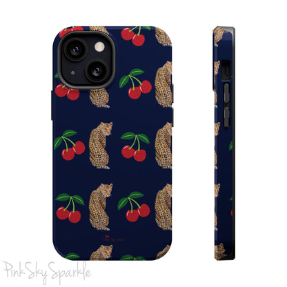 A stylish magnetic iPhone case featuring a unique pattern of leopards and bright red cherries on a dark navy blue background, blending bold and playful elements.