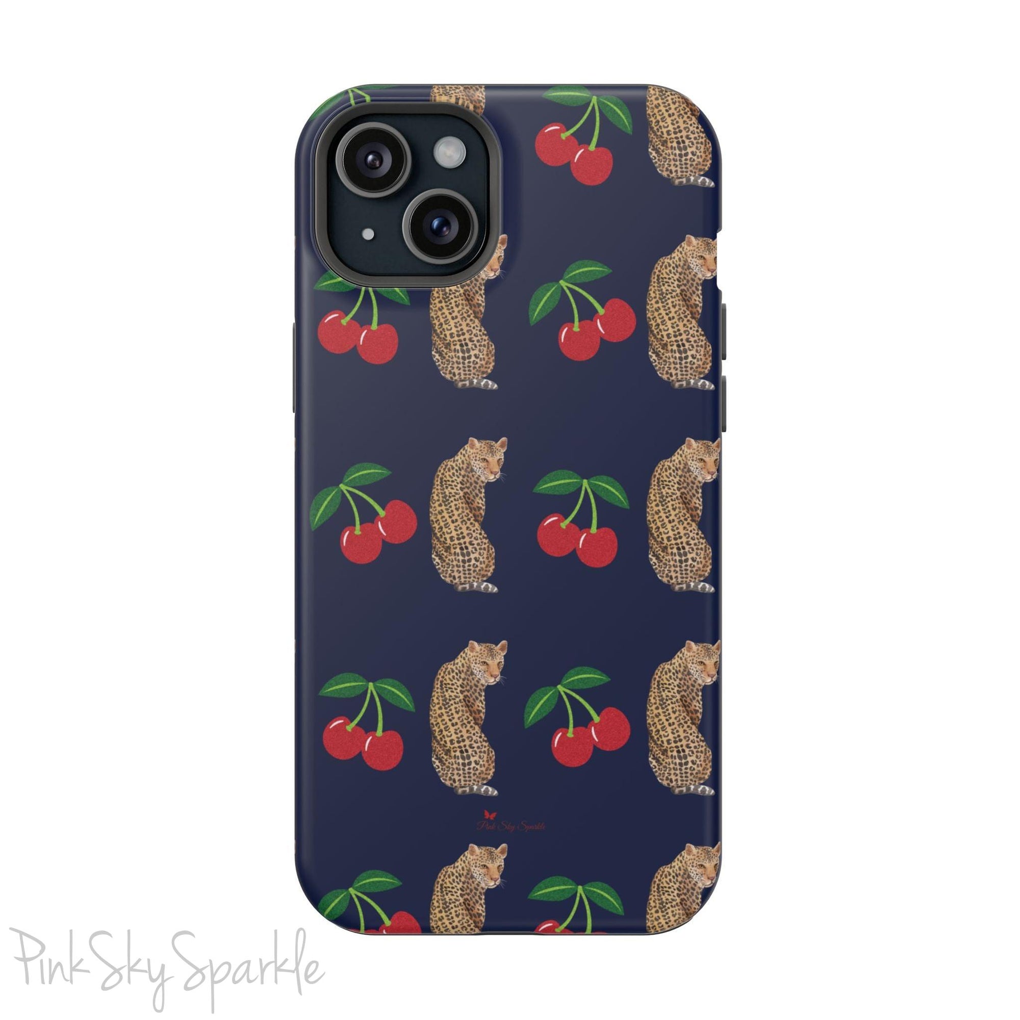 A stylish magnetic iPhone case featuring a unique pattern of leopards and bright red cherries on a dark navy blue background, blending bold and playful elements.