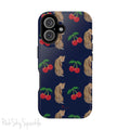 A stylish magnetic iPhone case featuring a unique pattern of leopards and bright red cherries on a dark navy blue background, blending bold and playful elements.
