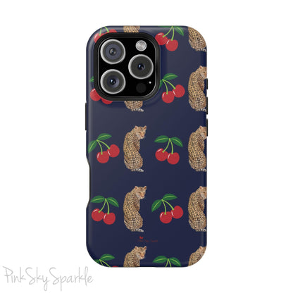 A stylish magnetic iPhone case featuring a unique pattern of leopards and bright red cherries on a dark navy blue background, blending bold and playful elements.