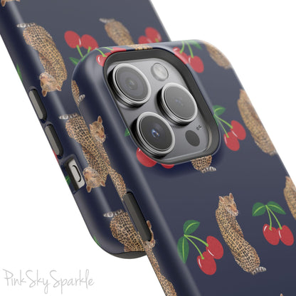 A stylish magnetic iPhone case featuring a unique pattern of leopards and bright red cherries on a dark navy blue background, blending bold and playful elements.