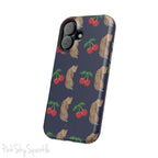 A stylish magnetic iPhone case featuring a unique pattern of leopards and bright red cherries on a dark navy blue background, blending bold and playful elements.