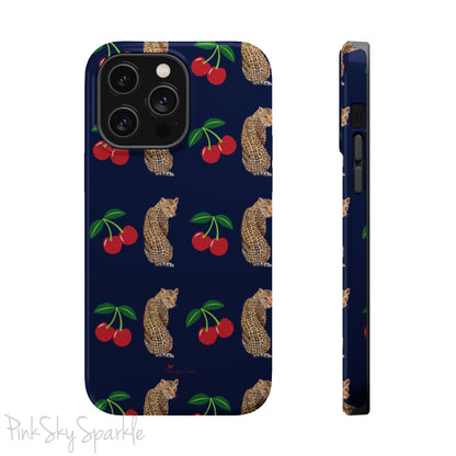 A stylish magnetic iPhone case featuring a unique pattern of leopards and bright red cherries on a dark navy blue background, blending bold and playful elements.