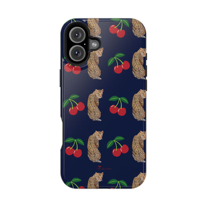 A stylish magnetic iPhone case featuring a unique pattern of leopards and bright red cherries on a dark navy blue background, blending bold and playful elements.