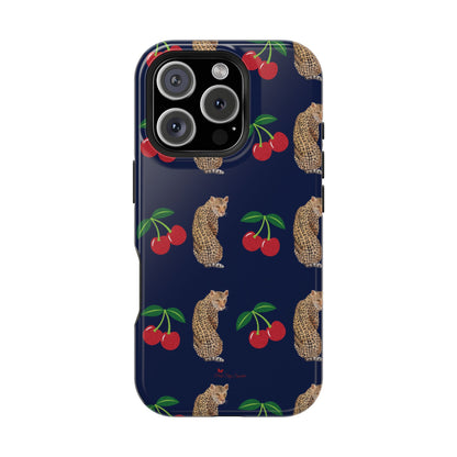 A stylish magnetic iPhone case featuring a unique pattern of leopards and bright red cherries on a dark navy blue background, blending bold and playful elements.