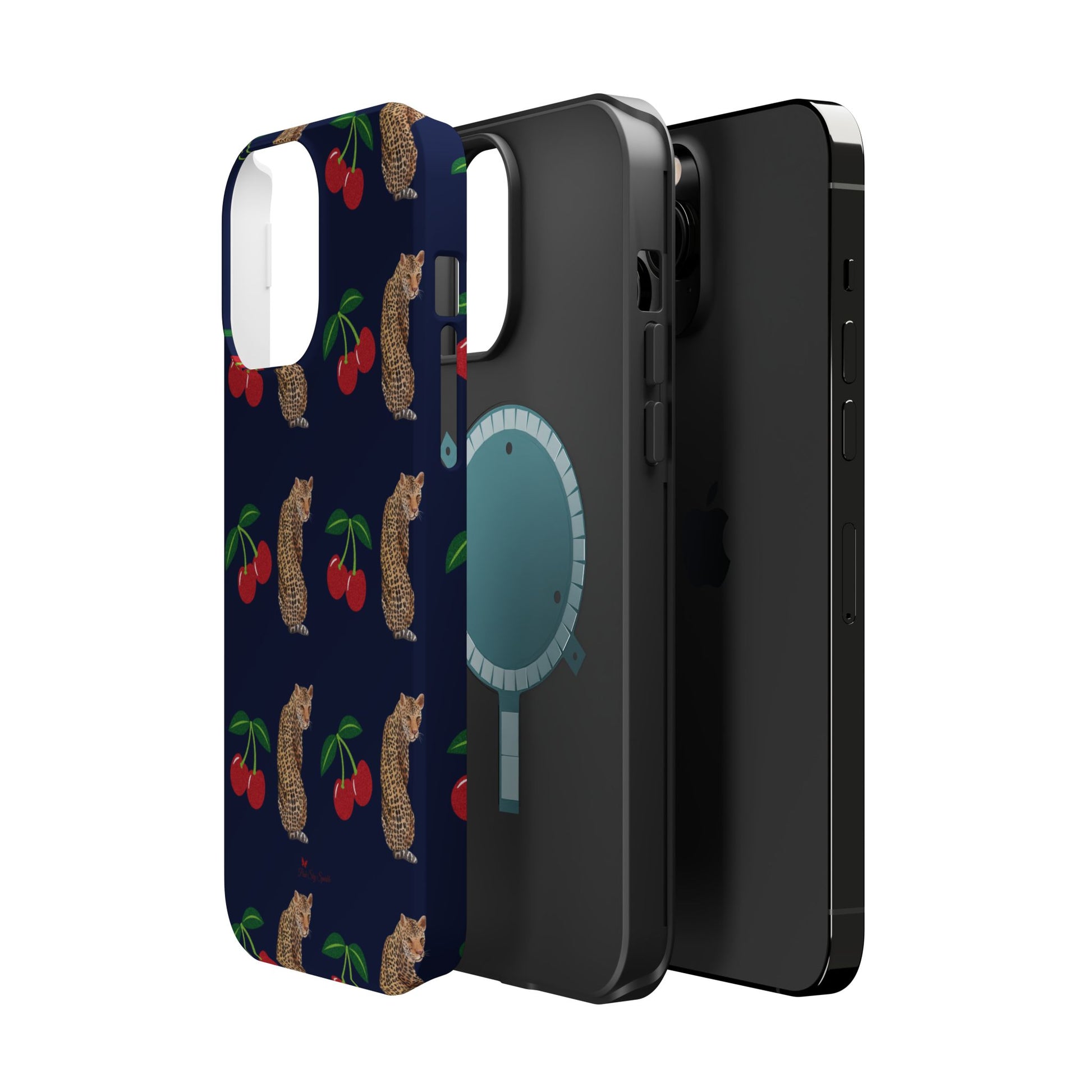 A stylish magnetic iPhone case featuring a unique pattern of leopards and bright red cherries on a dark navy blue background, blending bold and playful elements.