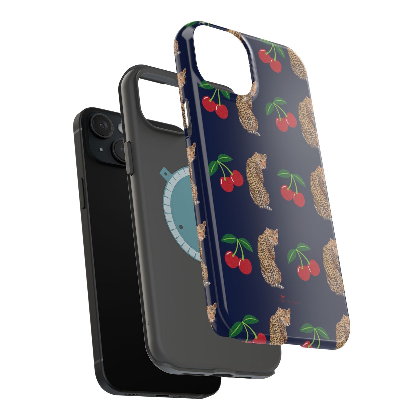 A stylish magnetic iPhone case featuring a unique pattern of leopards and bright red cherries on a dark navy blue background, blending bold and playful elements.