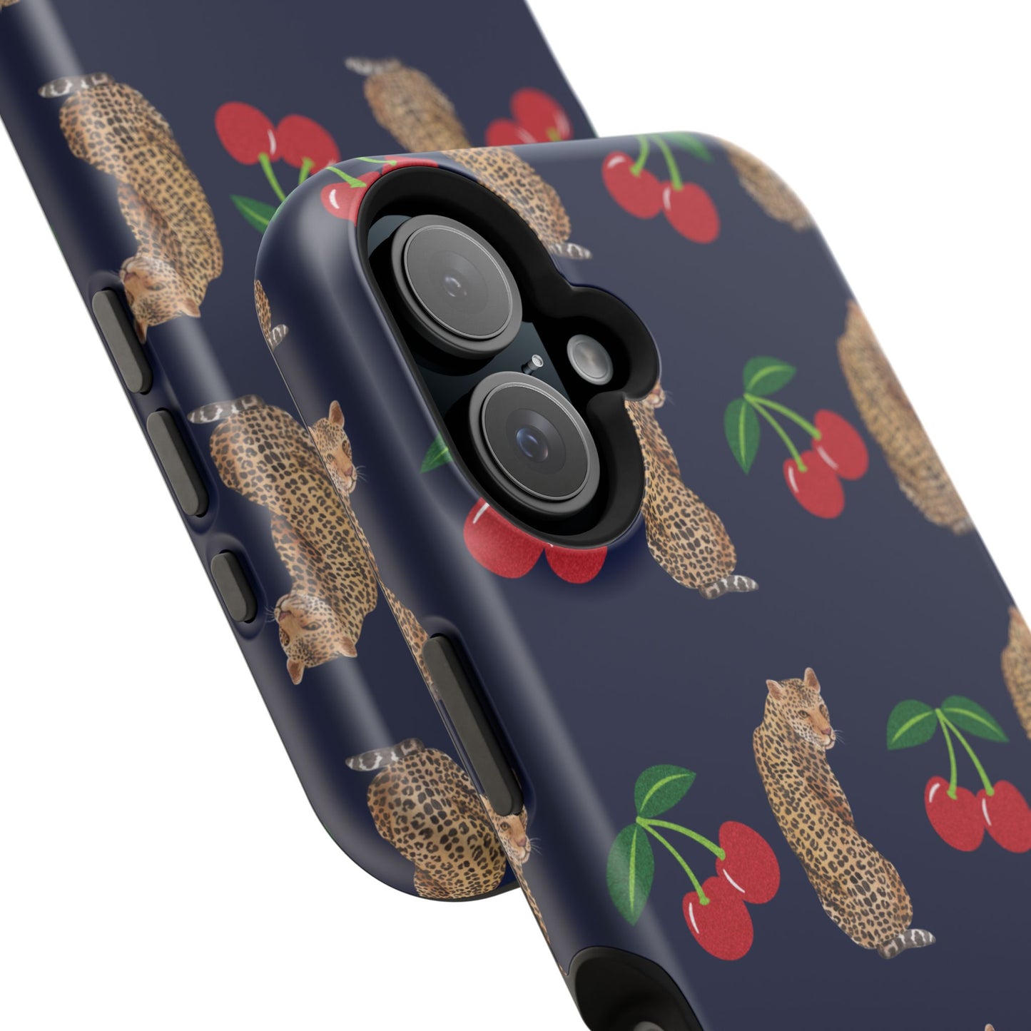 A stylish magnetic iPhone case featuring a unique pattern of leopards and bright red cherries on a dark navy blue background, blending bold and playful elements.