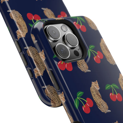 A stylish magnetic iPhone case featuring a unique pattern of leopards and bright red cherries on a dark navy blue background, blending bold and playful elements.