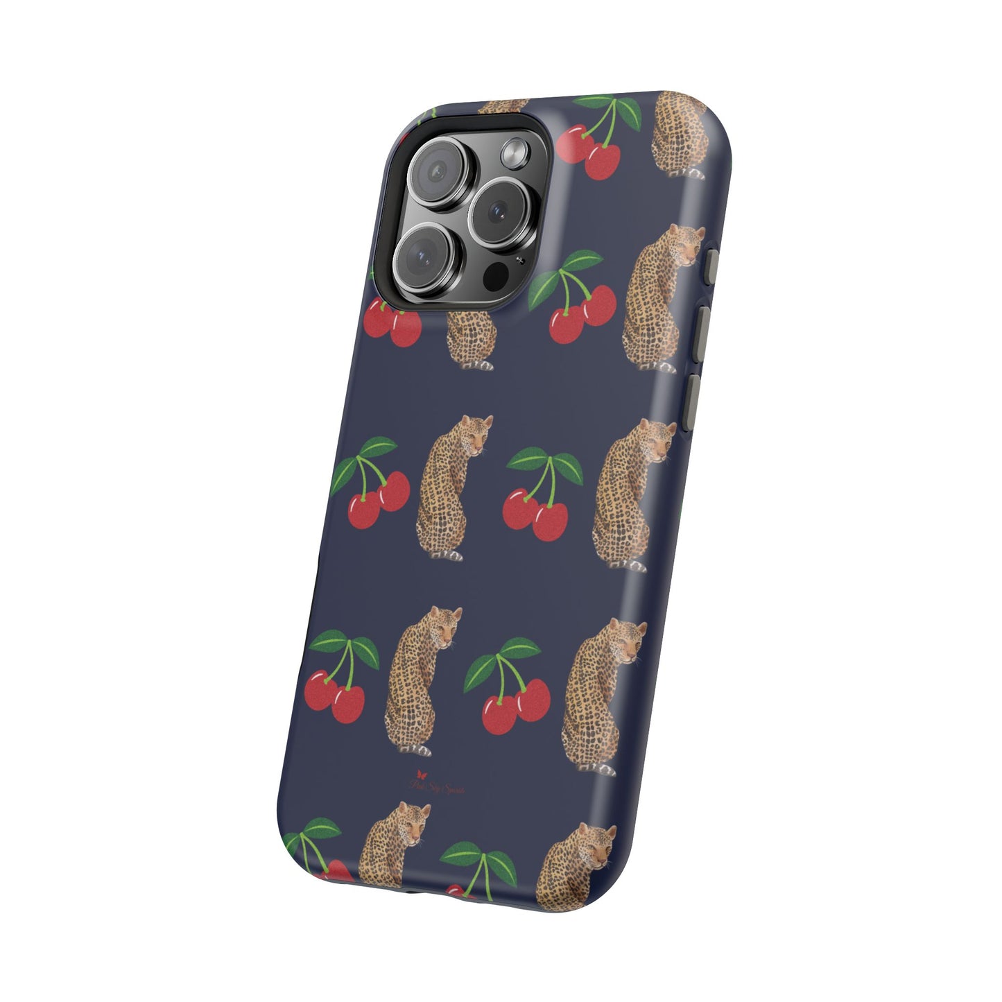 A stylish magnetic iPhone case featuring a unique pattern of leopards and bright red cherries on a dark navy blue background, blending bold and playful elements.