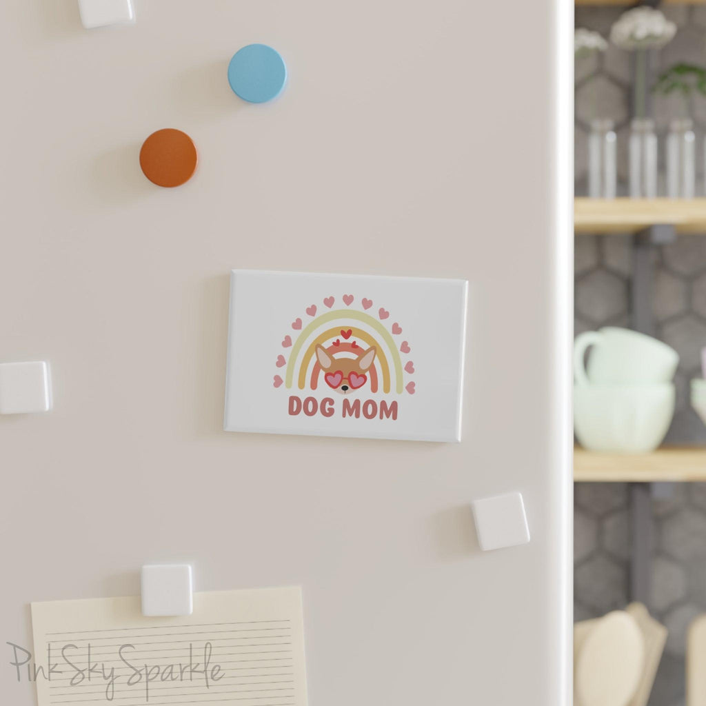 Dog Mom Rainbow & Hearts Rectangle Button Magnet. A white magnet featuring a boho style rainbow with hearts and a chihuahua wearing heart shaped glasses in the center and the words Dog Mom written in all caps below it.