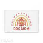 Dog Mom Rainbow & Hearts Rectangle Button Magnet. A white magnet featuring a boho style rainbow with hearts and a chihuahua wearing heart shaped glasses in the center and the words Dog Mom written in all caps below it.