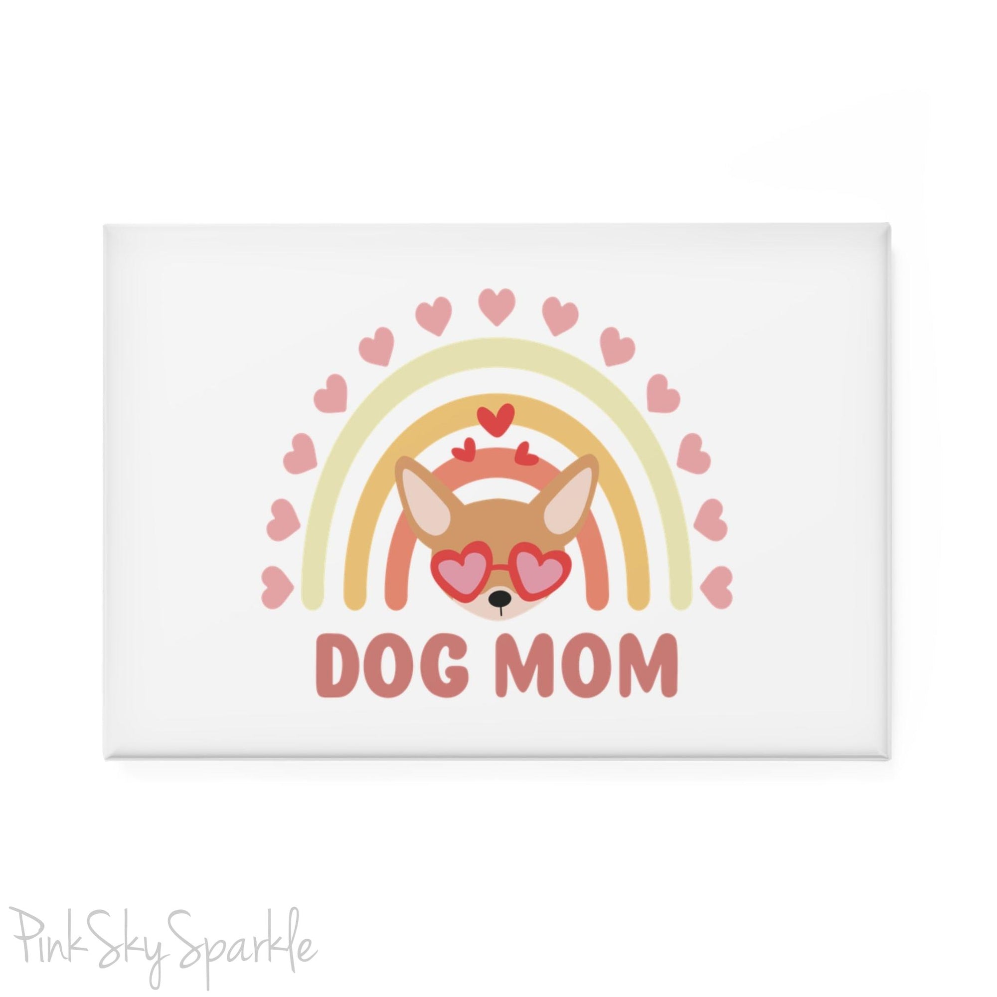 Dog Mom Rainbow & Hearts Rectangle Button Magnet. A white magnet featuring a boho style rainbow with hearts and a chihuahua wearing heart shaped glasses in the center and the words Dog Mom written in all caps below it.