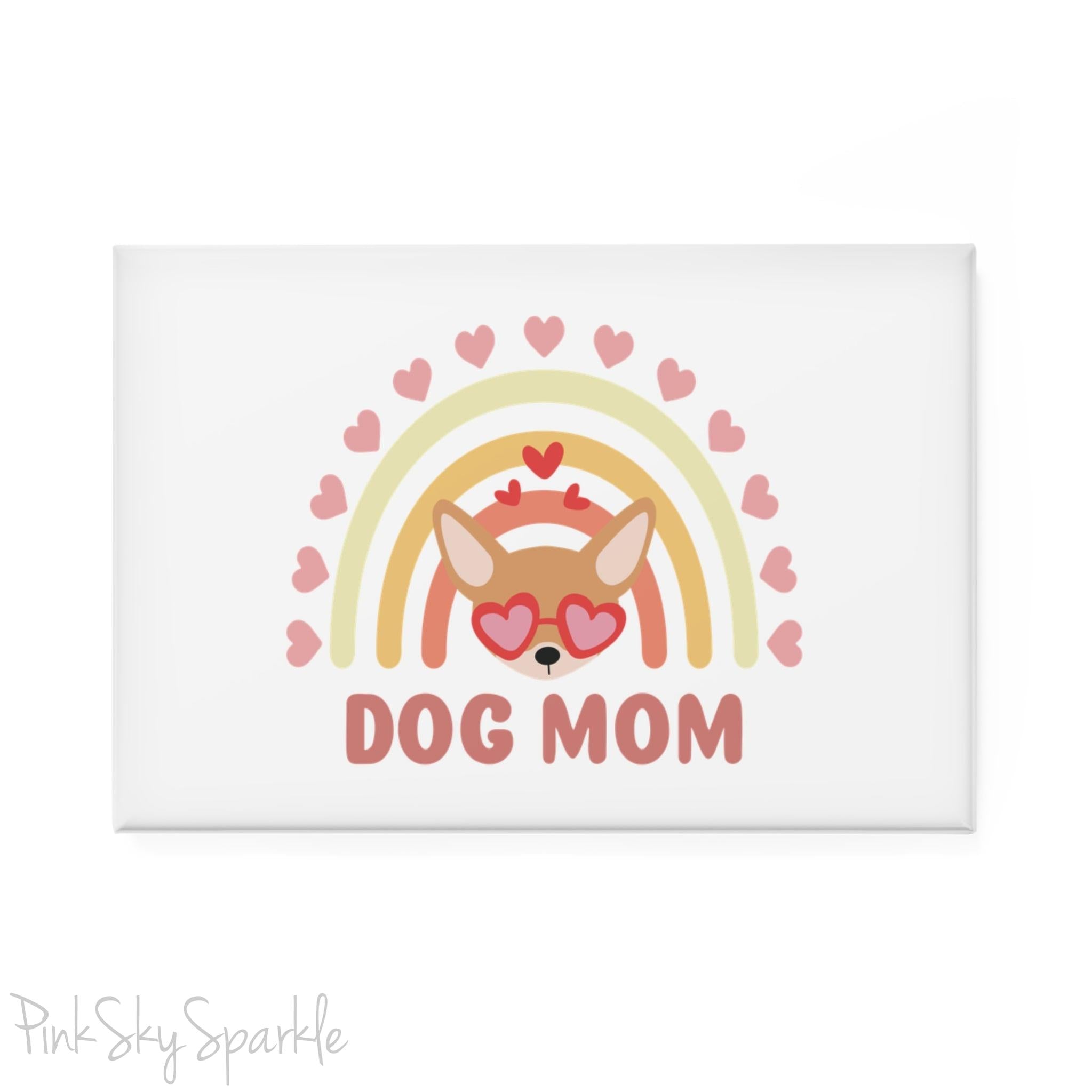 Dog Mom Rainbow & Hearts Rectangle Button Magnet. A white magnet featuring a boho style rainbow with hearts and a chihuahua wearing heart shaped glasses in the center and the words Dog Mom written in all caps below it.