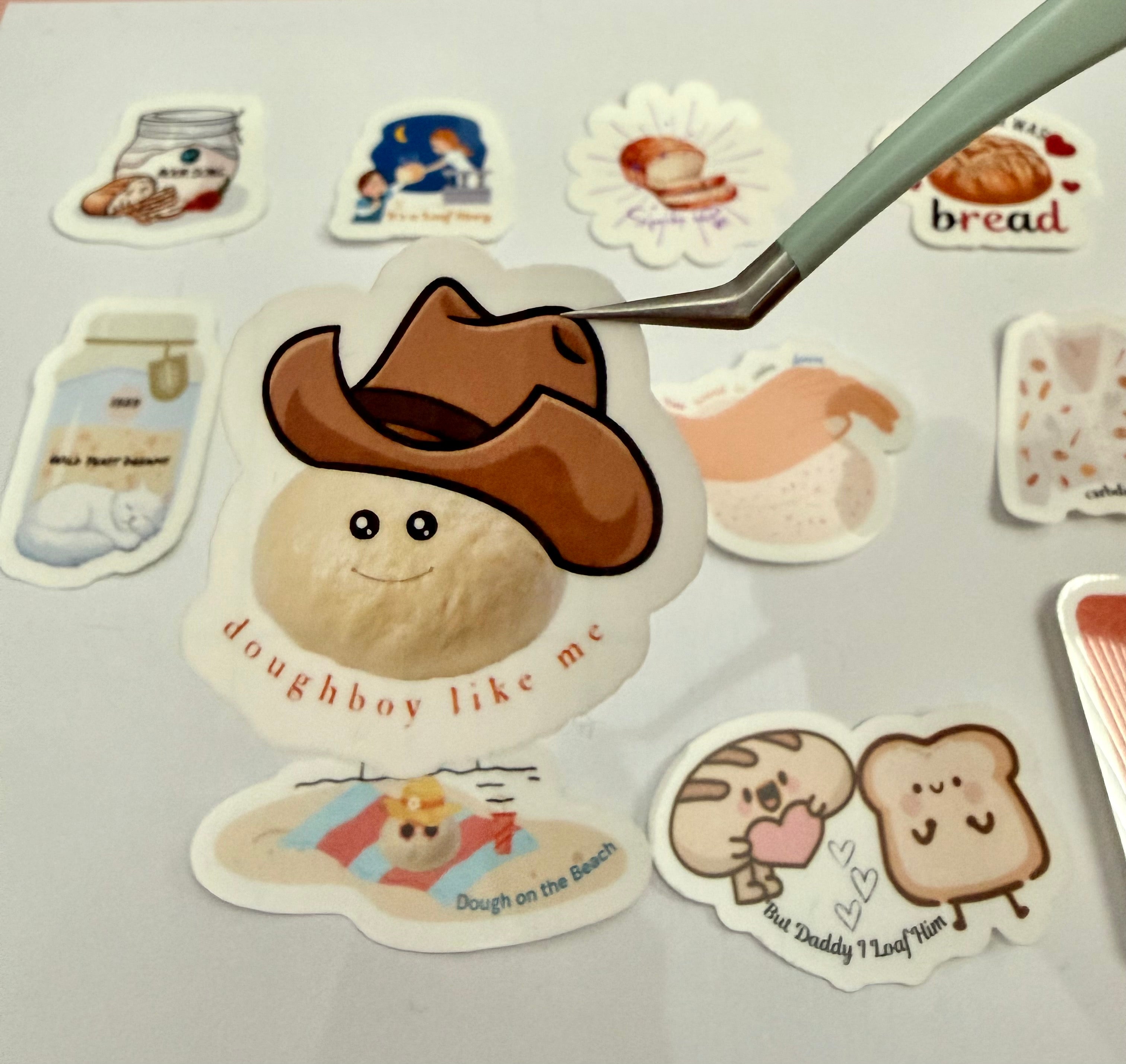 Sticker with a cartoon doughboy wearing a cowboy hat with the pun 'doughboy like me'.