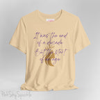 Embrace the excitement of a new era with our End of a Decade, Start of an Age T-shirt, inspired by Taylor Swift's iconic lyrics. Featuring the words It was the end of a decade, But the start of an age in a purple marker script font with a gold silhouette of a woman wearing a crown.