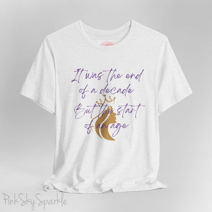 Embrace the excitement of a new era with our End of a Decade, Start of an Age T-shirt, inspired by Taylor Swift's iconic lyrics. Featuring the words It was the end of a decade, But the start of an age in a purple marker script font with a gold silhouette of a woman wearing a crown.
