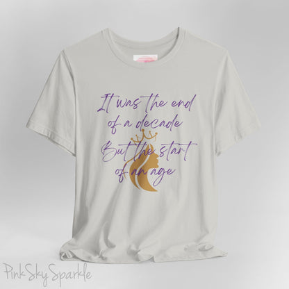 Embrace the excitement of a new era with our End of a Decade, Start of an Age T-shirt, inspired by Taylor Swift's iconic lyrics. Featuring the words It was the end of a decade, But the start of an age in a purple marker script font with a gold silhouette of a woman wearing a crown.