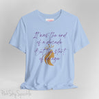 Embrace the excitement of a new era with our End of a Decade, Start of an Age T-shirt, inspired by Taylor Swift's iconic lyrics. Featuring the words It was the end of a decade, But the start of an age in a purple marker script font with a gold silhouette of a woman wearing a crown.