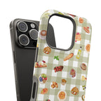 Phone case with food-themed design on a checkered background