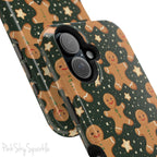 Gingerbread Dreams Magnetic iPhone Case featuring whimsical gingerbread cookies and a festive holiday design in warm, cozy colors. Compatible with iPhone models 13, 14, 15, and 16, this durable case is both stylish and protective, perfect for spreading holiday cheer.