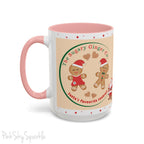 Holiday Gingerbread Coffee Mug featuring a male and female gingerbread cookies next to Santa with giving a thumbs up and the writing The Sugary Ginger Co. written at the top and Santa's favourite cookies at the bottom. The mug has a pink handle and pink interior. 