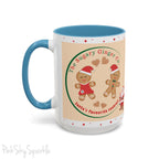 Holiday Gingerbread Coffee Mug featuring a male and female gingerbread cookies next to Santa with giving a thumbs up and the writing The Sugary Ginger Co. written at the top and Santa's favourite cookies at the bottom. The mug has a light blue handle and light blue interior. 