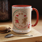 Holiday Gingerbread Coffee Mug featuring a male and female gingerbread cookies next to Santa with giving a thumbs up and the writing The Sugary Ginger Co. written at the top and Santa's favourite cookies at the bottom. The mug has a red handle and red interior. 