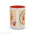 Holiday Gingerbread Coffee Mug featuring a male and female gingerbread cookies next to Santa with giving a thumbs up and the writing The Sugary Ginger Co. written at the top and Santa's favourite cookies at the bottom. The mug has a red handle and red interior. 