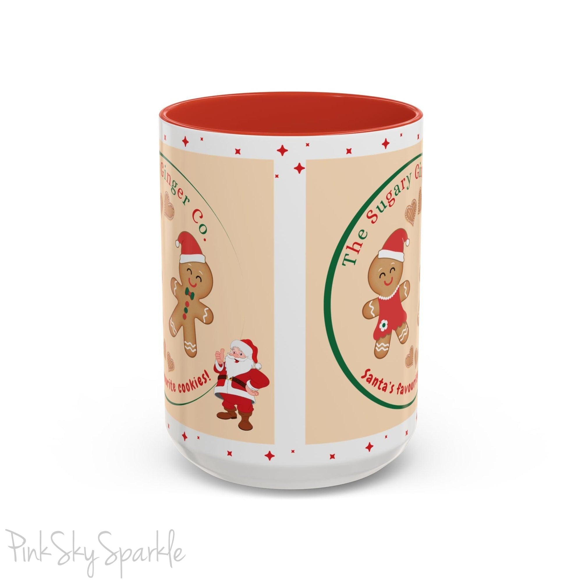 Holiday Gingerbread Coffee Mug featuring a male and female gingerbread cookies next to Santa with giving a thumbs up and the writing The Sugary Ginger Co. written at the top and Santa's favourite cookies at the bottom. The mug has a red handle and red interior. 