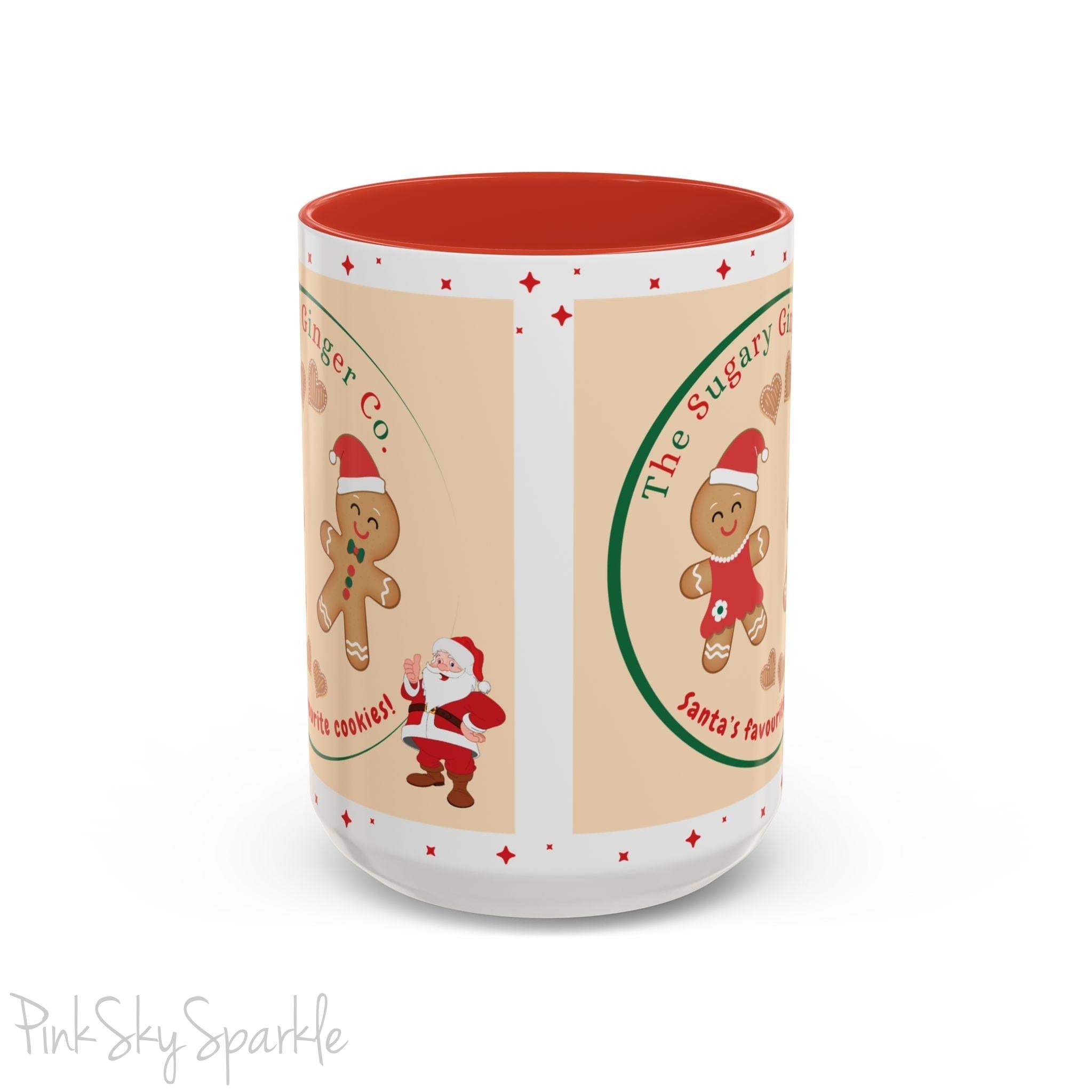 Holiday Gingerbread Coffee Mug featuring a male and female gingerbread cookies next to Santa with giving a thumbs up and the writing The Sugary Ginger Co. written at the top and Santa's favourite cookies at the bottom. The mug has a red handle and red interior. 