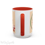Holiday Gingerbread Coffee Mug featuring a male and female gingerbread cookies next to Santa with giving a thumbs up and the writing The Sugary Ginger Co. written at the top and Santa's favourite cookies at the bottom. The mug has a red handle and red interior. 