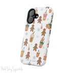 Holiday Sips and Sweets Magnetic iPhone Case featuring gingerbread cookies and festive holiday iced coffees. Compatible with iPhone models 13, 14, 15, and 16, this protective case adds a cozy and whimsical holiday vibe to your device.