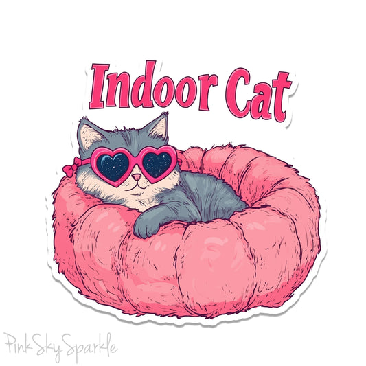 Indoor Cat Waterproof Sticker - Cute sticker of a cat in a pink bed with heart-shaped glasses, perfect for laptops, water bottles, planners, and more. Durable, waterproof vinyl with scratch-resistant lamination. Ideal for cat lovers and unique decor.