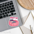 Indoor Cat Waterproof Sticker - Cute sticker of a cat in a pink bed with heart-shaped glasses, perfect for laptops, water bottles, planners, and more. Durable, waterproof vinyl with scratch-resistant lamination. Ideal for cat lovers and unique decor.