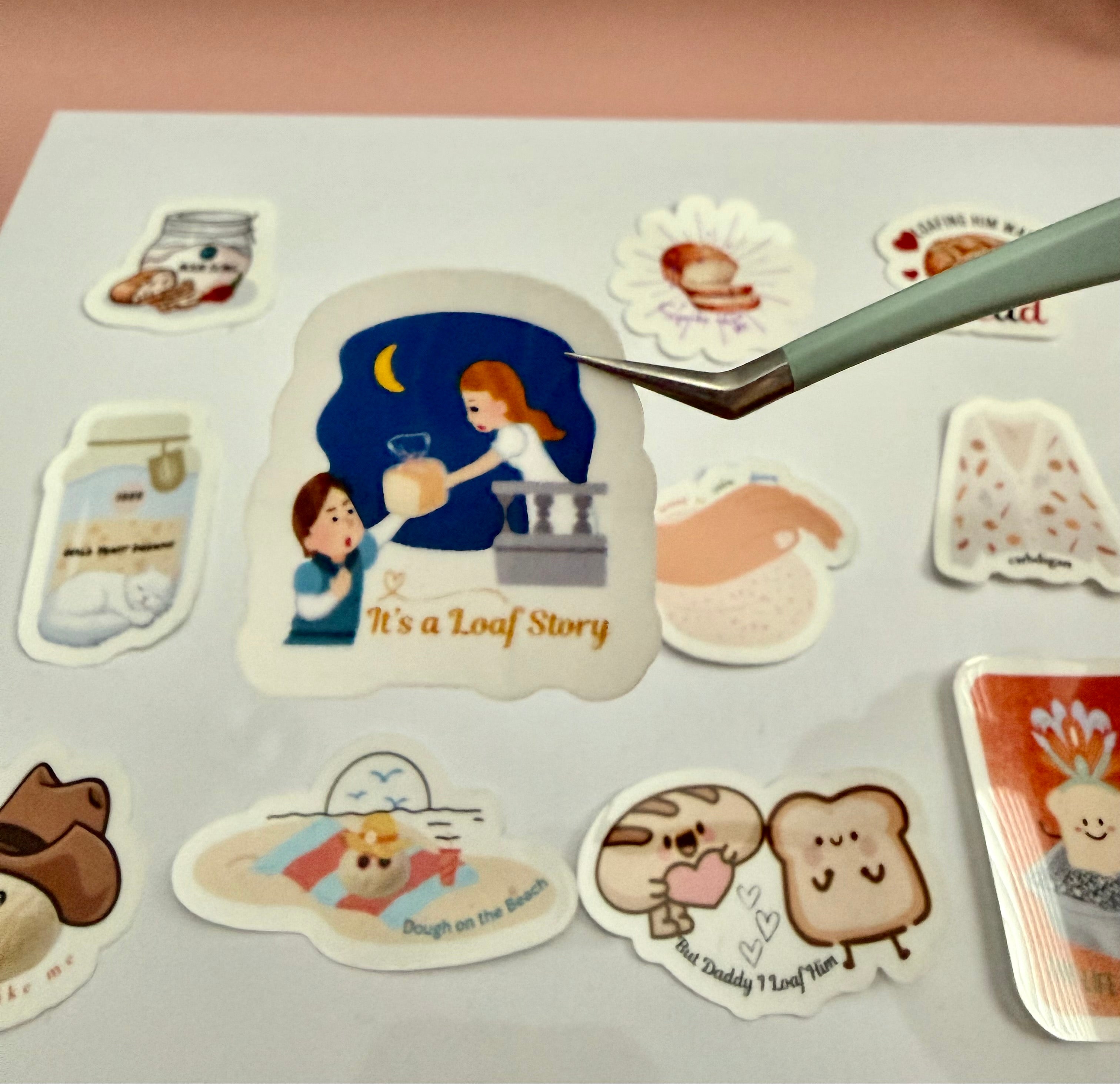 Romeo and Juliet on a sticker, Romeo handing her a loaf of bread and the words 'it's a loaf story' bread pun.