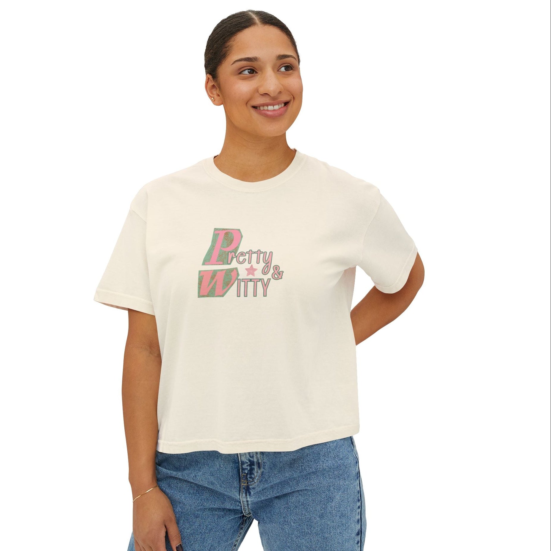 Woman wearing a white t-shirt with 'Betty & Witty' text, standing against a white background
