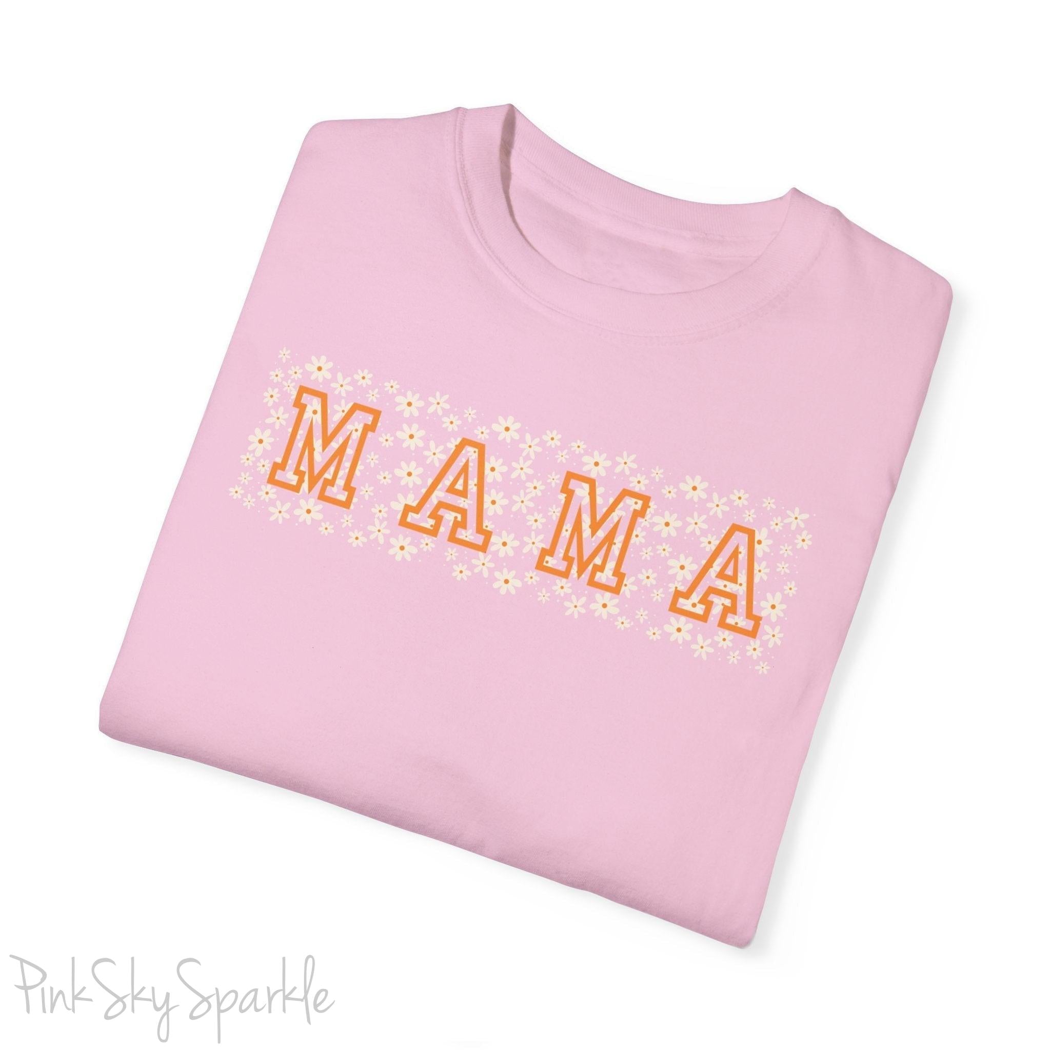 The bold 'MAMA' lettering, overlaid on a charming daisy pattern, makes this shirt a standout piece. Whether you're running errands, meeting friends for coffee, or just enjoying a quiet day at home, this t-shirt is your go-to for effortless style.&nbsp;