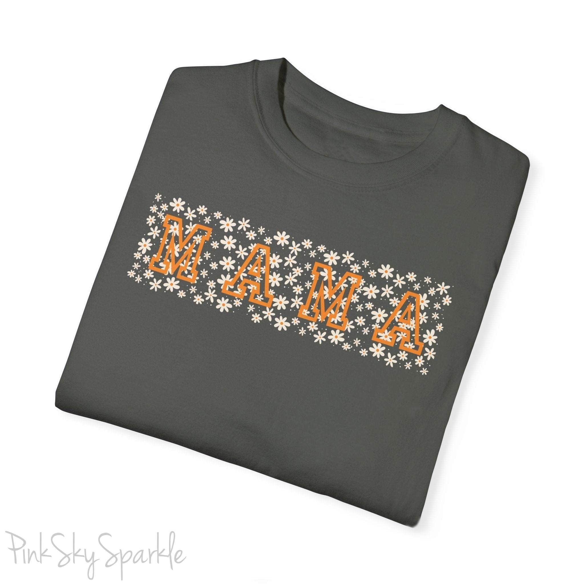 The bold 'MAMA' lettering, overlaid on a charming daisy pattern, makes this shirt a standout piece. Whether you're running errands, meeting friends for coffee, or just enjoying a quiet day at home, this t-shirt is your go-to for effortless style.&nbsp;