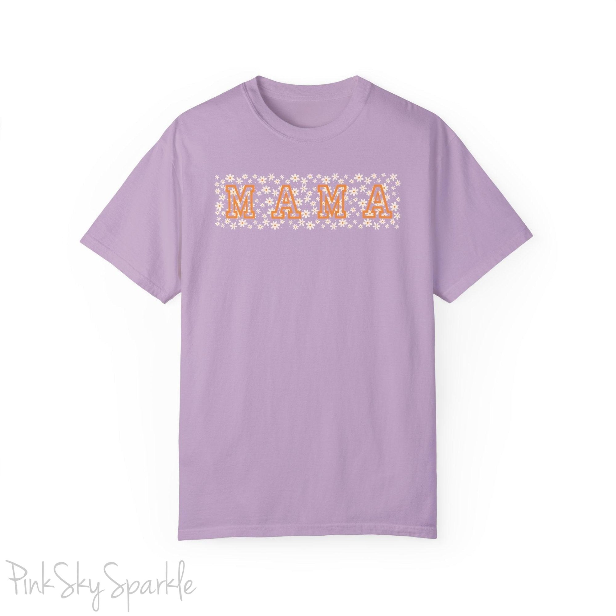 The bold 'MAMA' lettering, overlaid on a charming daisy pattern, makes this shirt a standout piece. Whether you're running errands, meeting friends for coffee, or just enjoying a quiet day at home, this t-shirt is your go-to for effortless style.&nbsp;